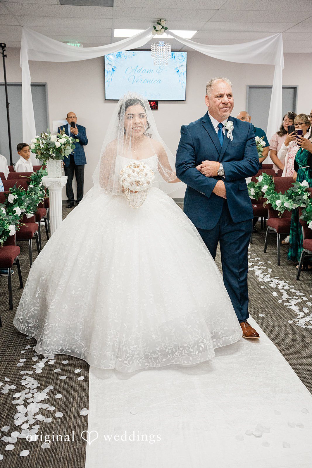 Bride walking down the aisle at Towngate Community Center