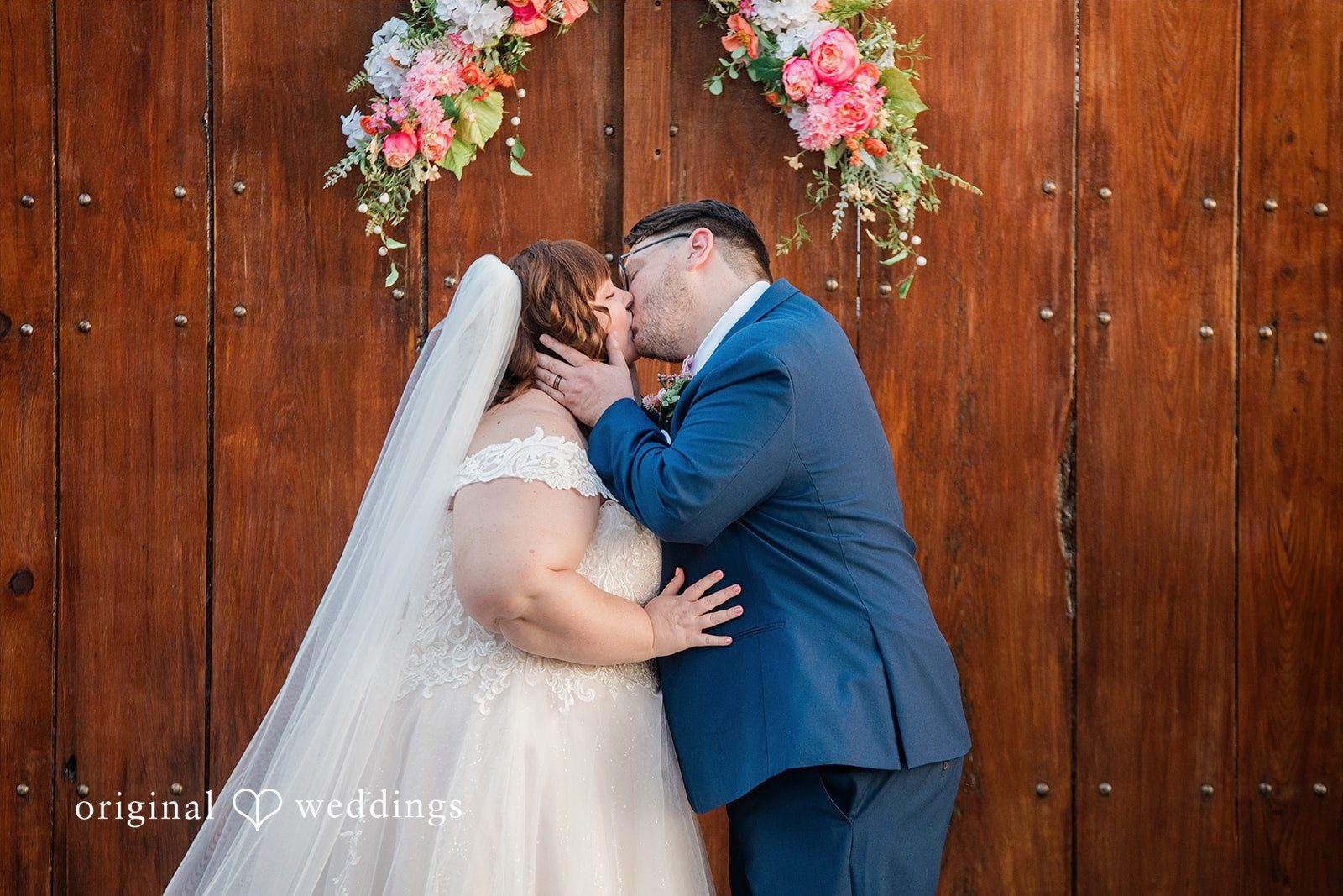Hilary + Thomas The couple takes their first kiss