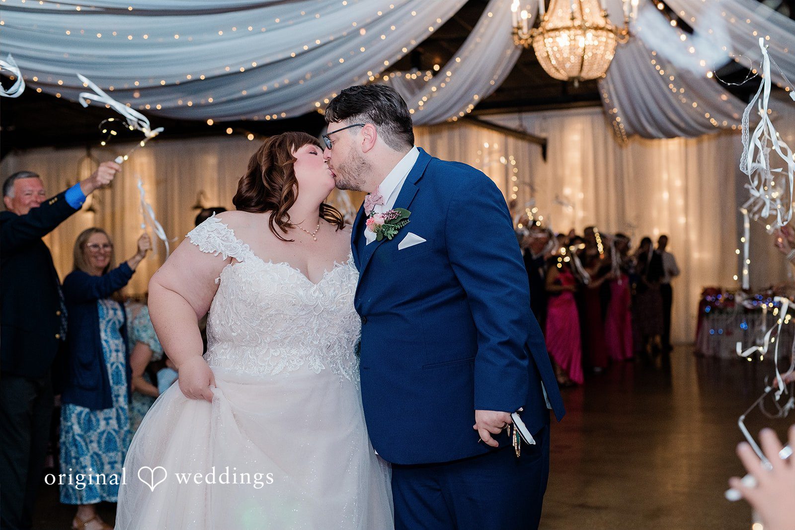 Hilary + Thomas The couple shares a romantic kiss to seal the night