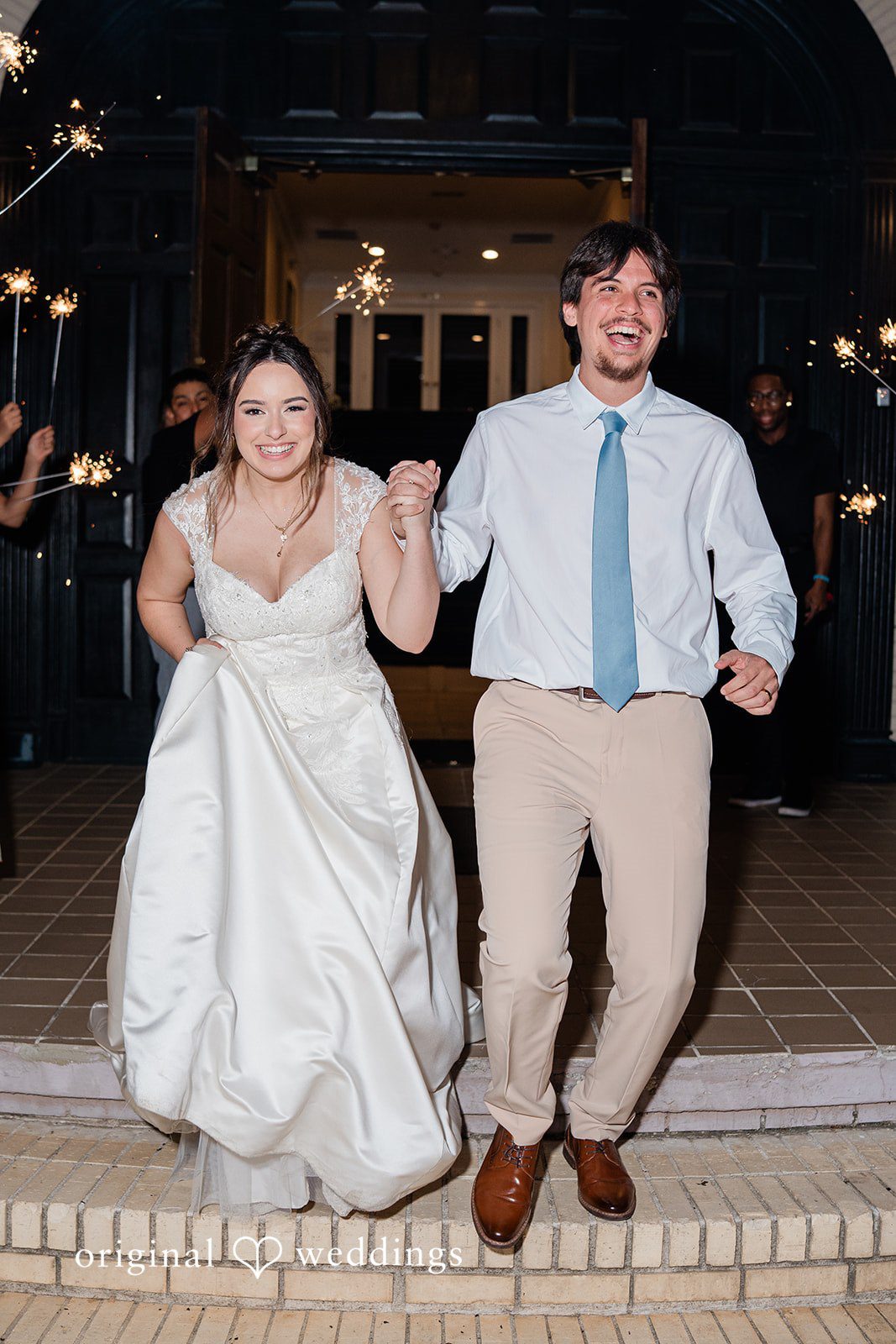 Atlanta Wedding Photographers capturing couple entering reception at Vines Mansion by Original Weddings