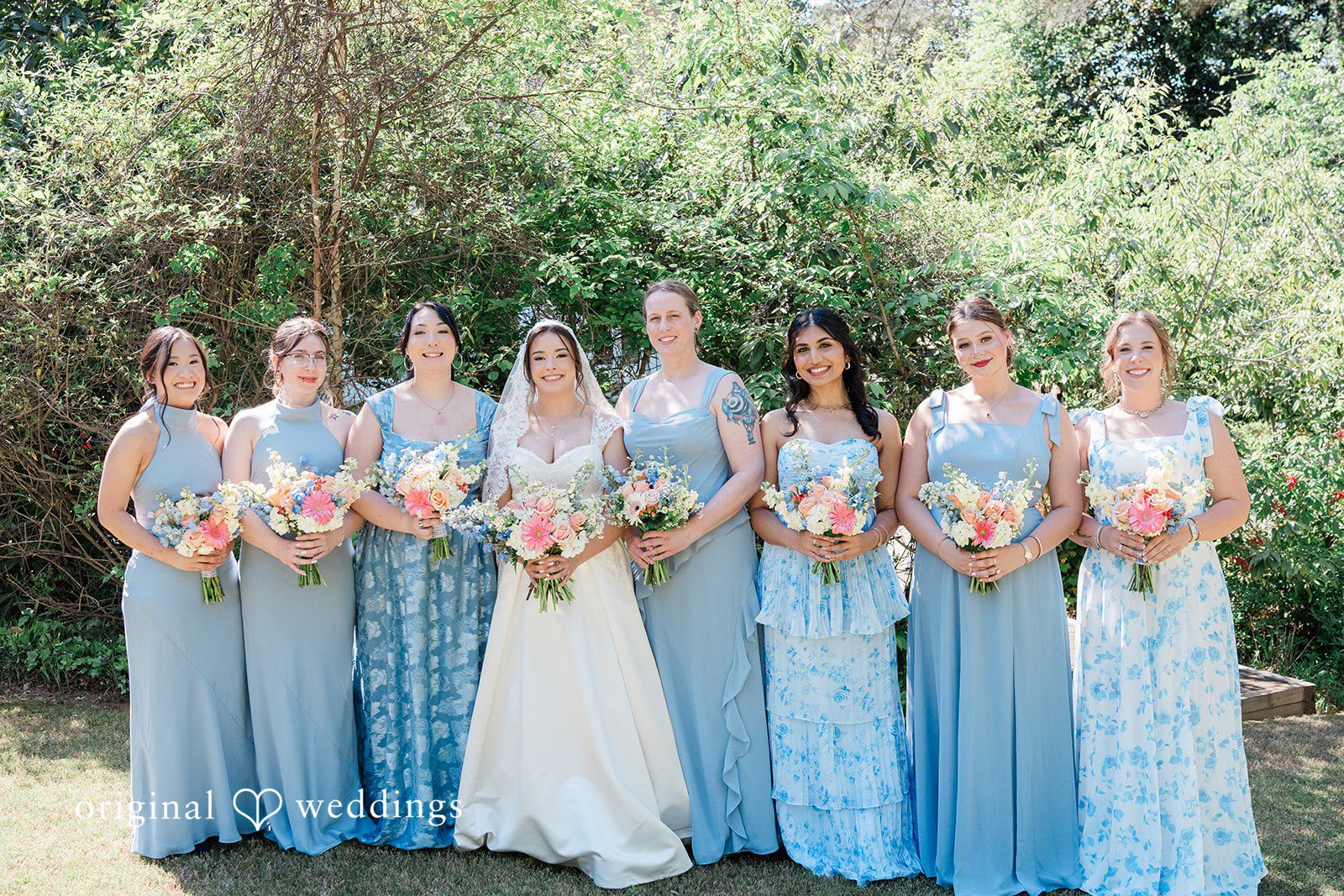 Beautiful group shot of bride with bridesmaids on wedding day