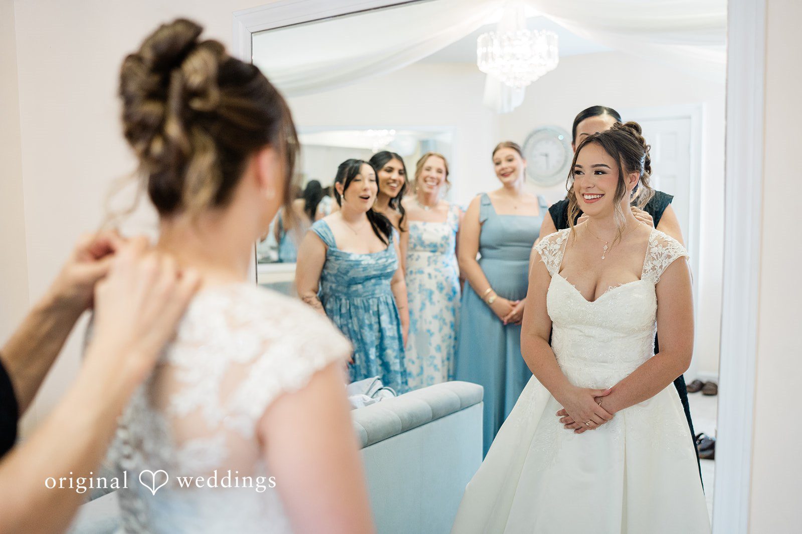 Candid bridal preparation moment with bridesmaids