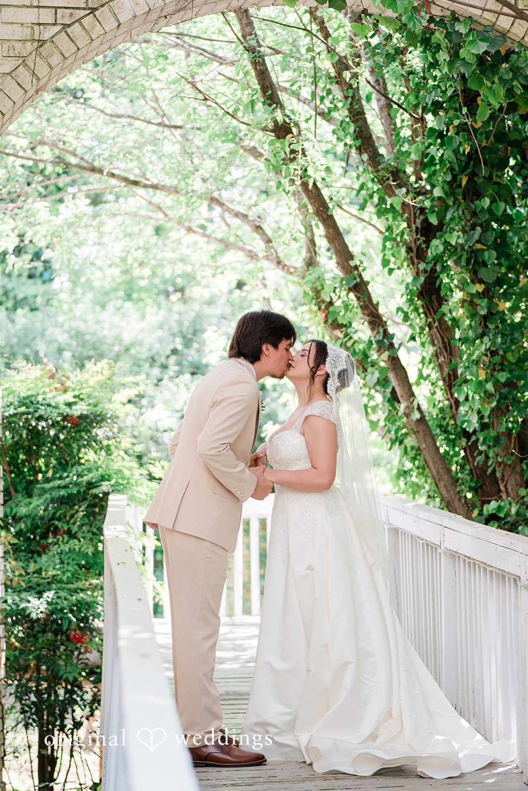 Emotional wedding kiss shot at Vines Mansion