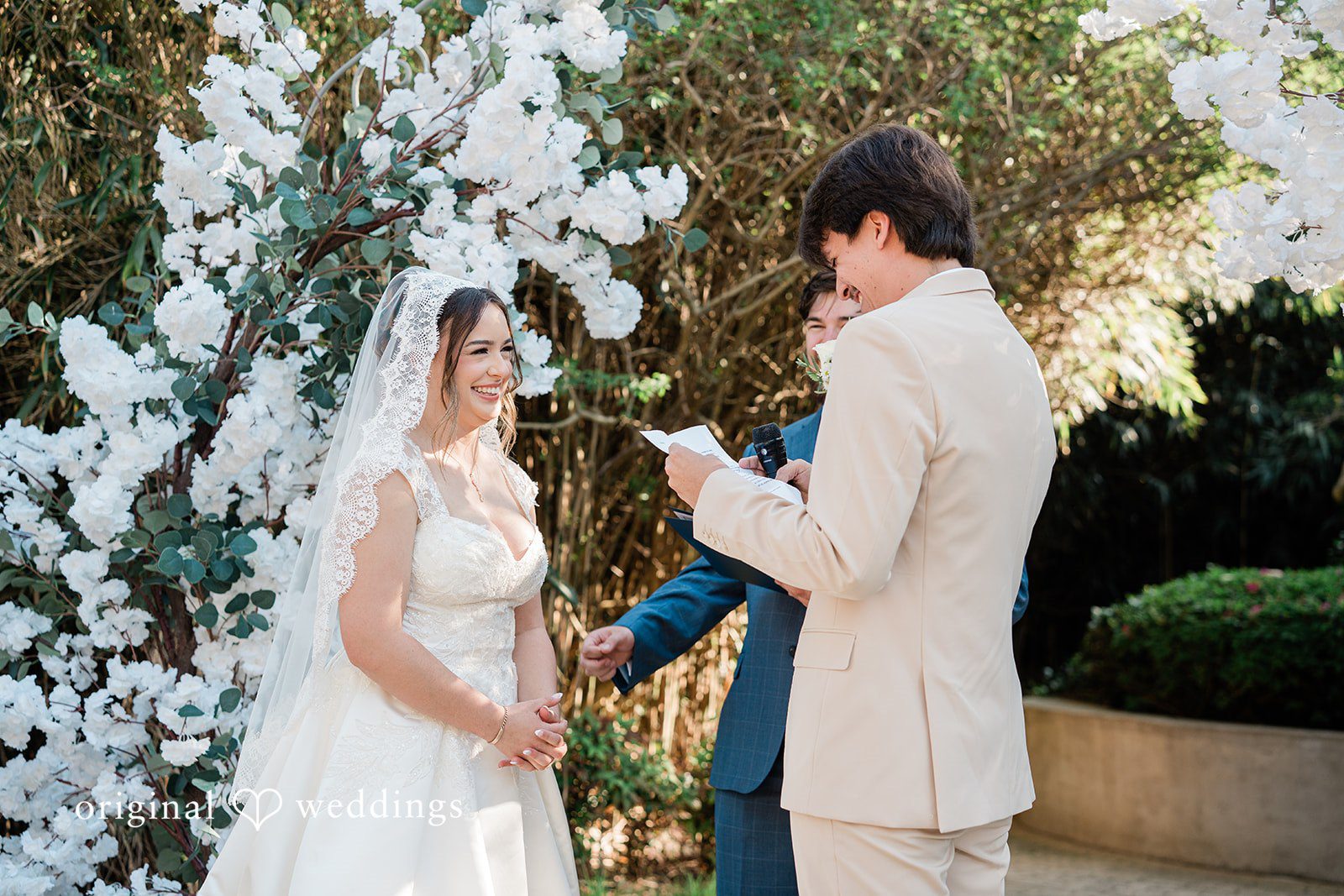 Elegant groom reading from paper during ceremony