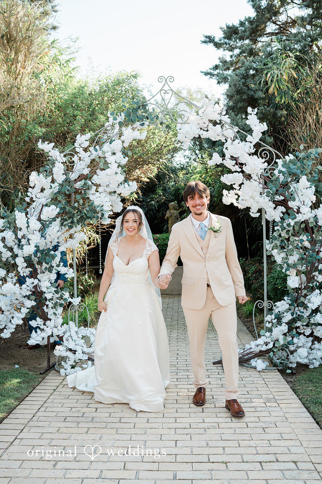 Atlanta wedding photographers capturing bride and groom walking forward at Vines Mansion by Original Weddings
