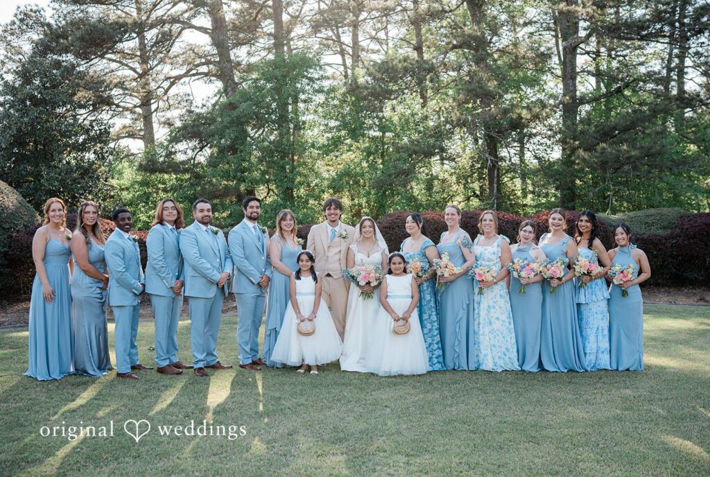 Atlanta Wedding Photographers capturing couple group photo with bridesmaids and groomsmen at Vines Mansion by Original Weddings