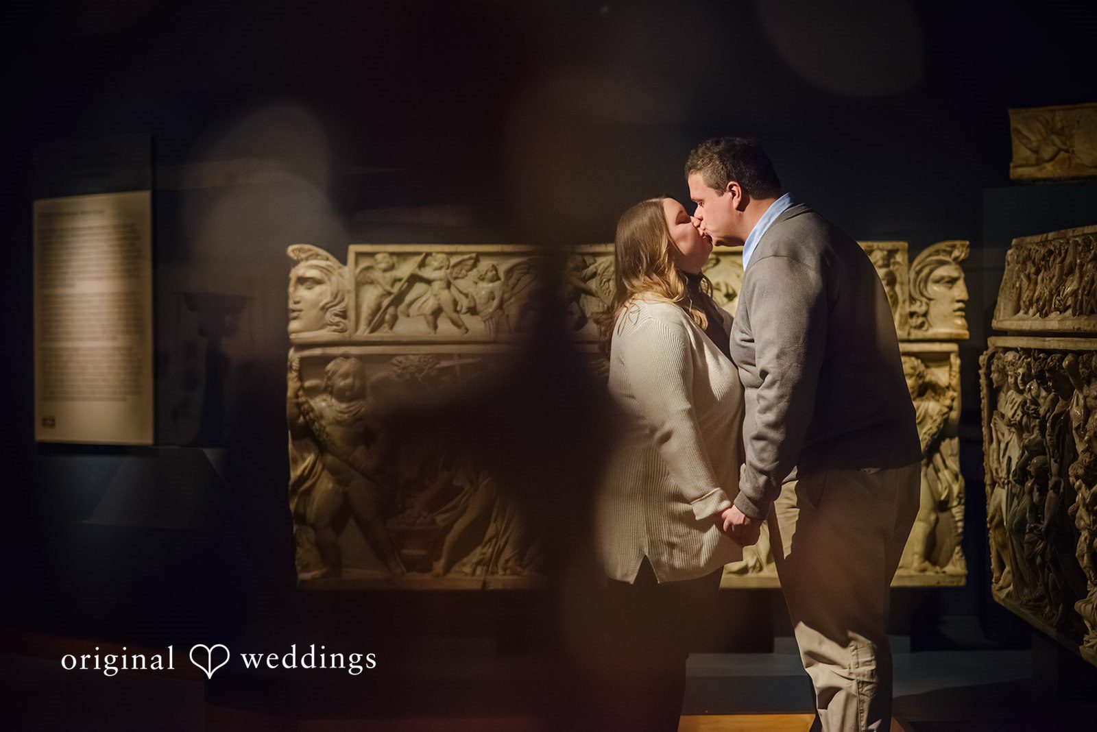 Nicole + Greg The couple shares a romantic kiss at the museum
