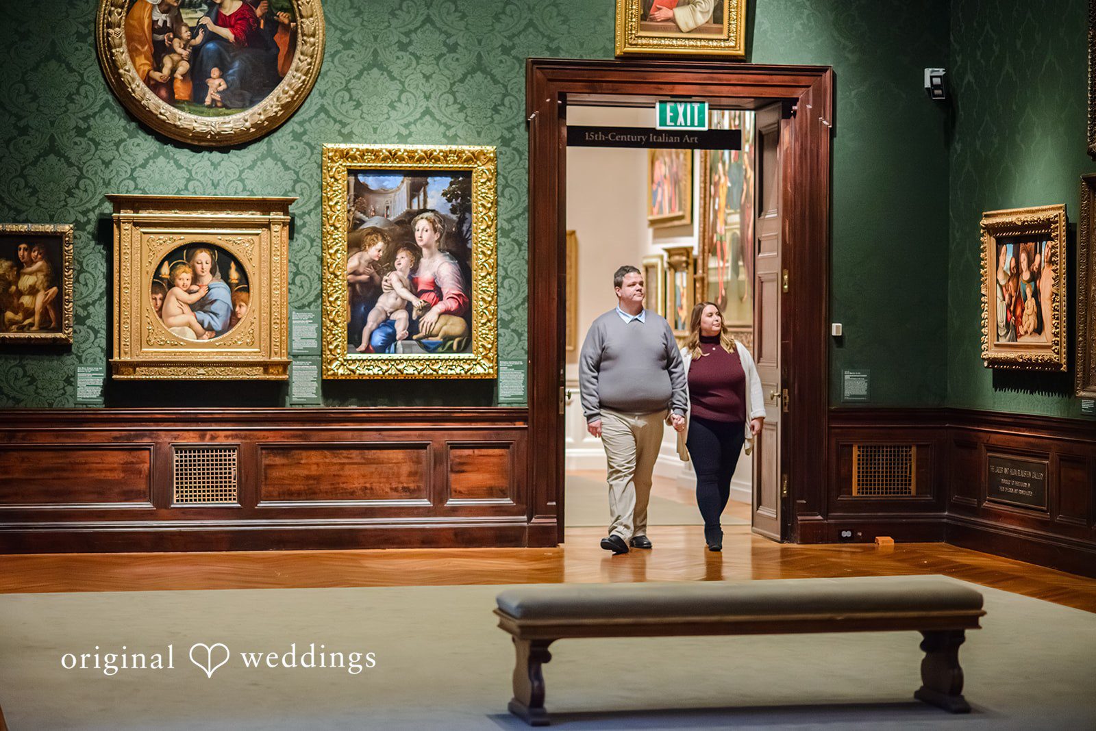 Nicole + Greg The couple walks into the museum