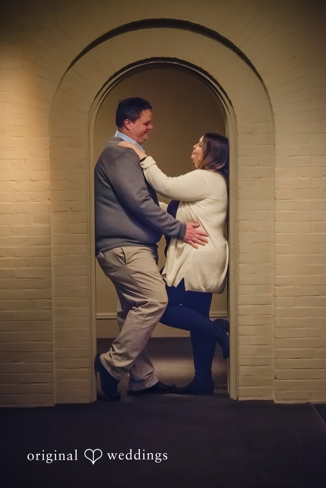 Nicole + Greg A beautiful portrait of the couple framed by the architectural beauty of the Walters Art Museum