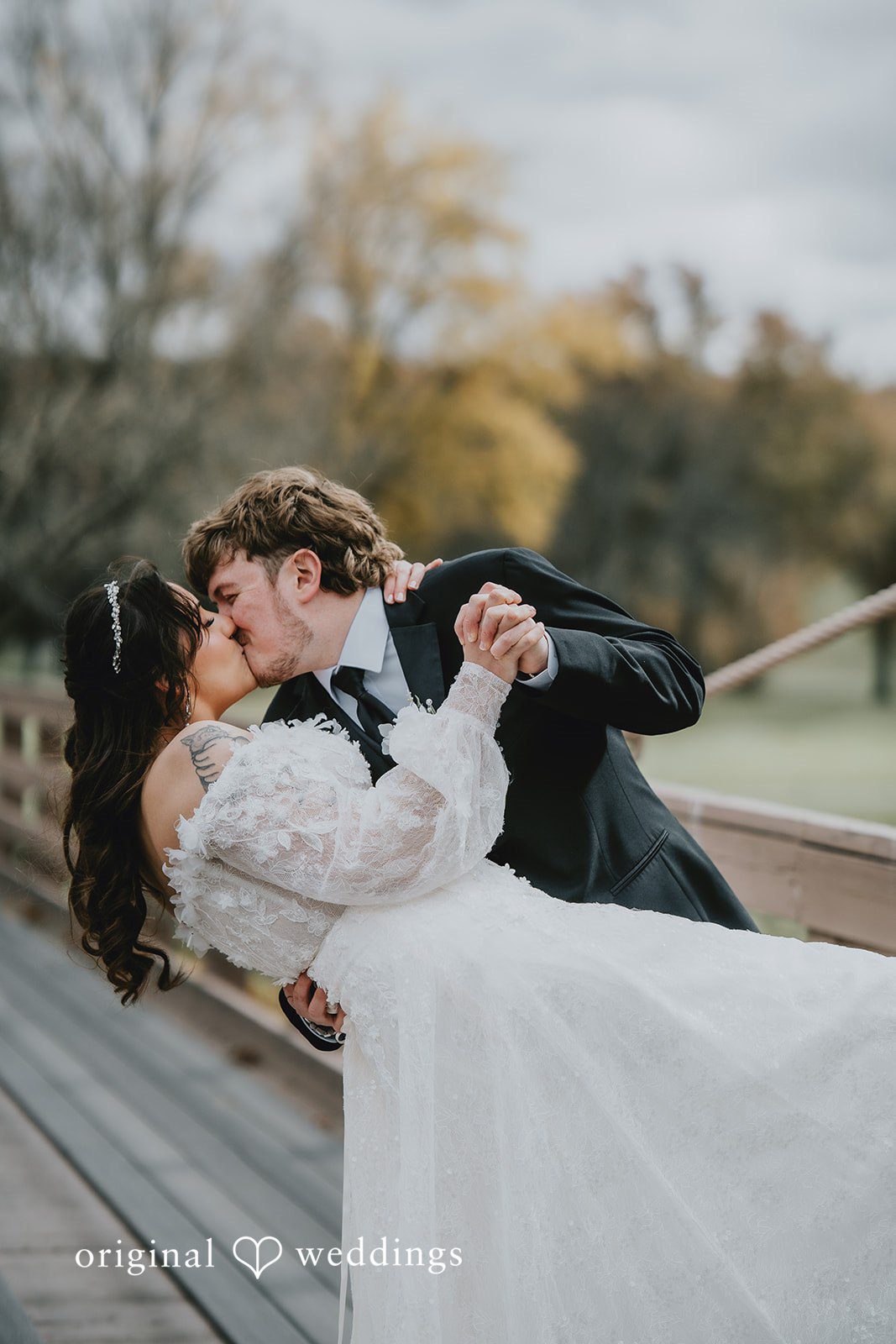 New York wedding photography by Original Weddings capturing romantic kiss of bride and groom at West Hills Country Club