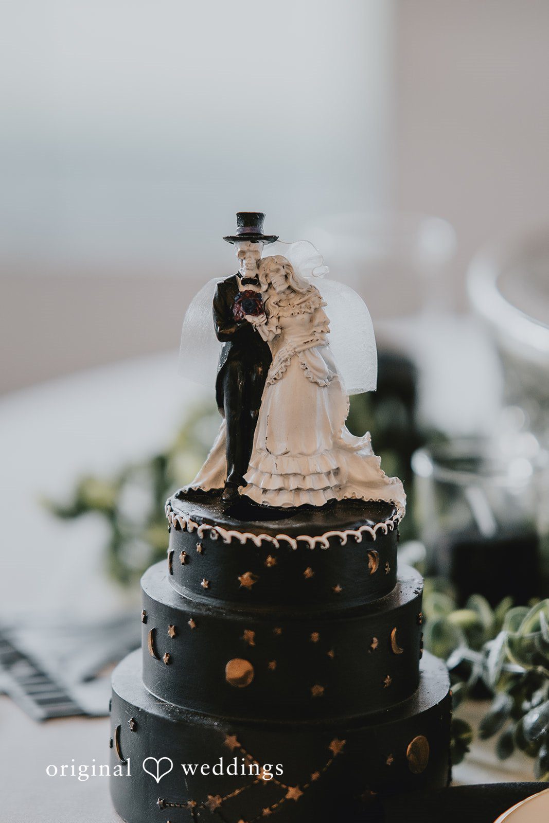 Romantic cake design with bride and groom topper at West Hills Country Club