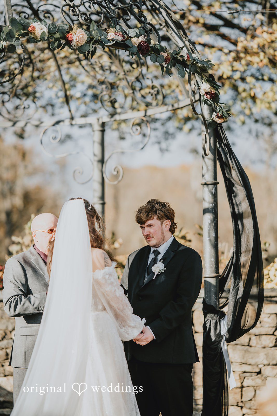 Lovely couple sharing a romantic look at West Hills Country Club