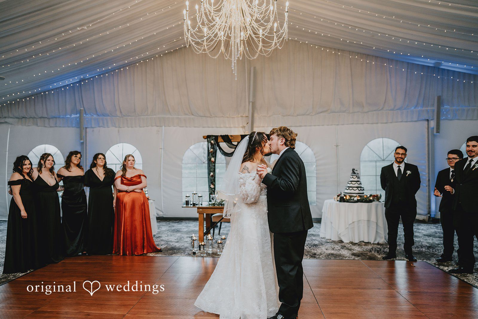 Loving bride and groom sharing romantic kiss while dancing at West Hills Country Club