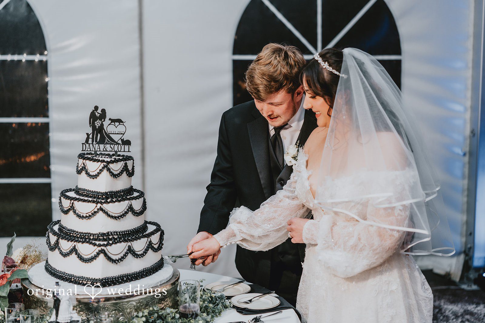 Couple cutting wedding cake at West Hills Country Club