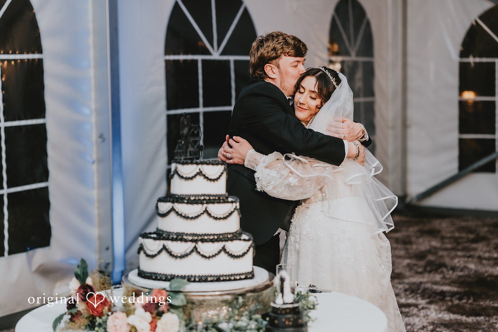 Beautiful candid hug and kiss moment at West Hills Country Club