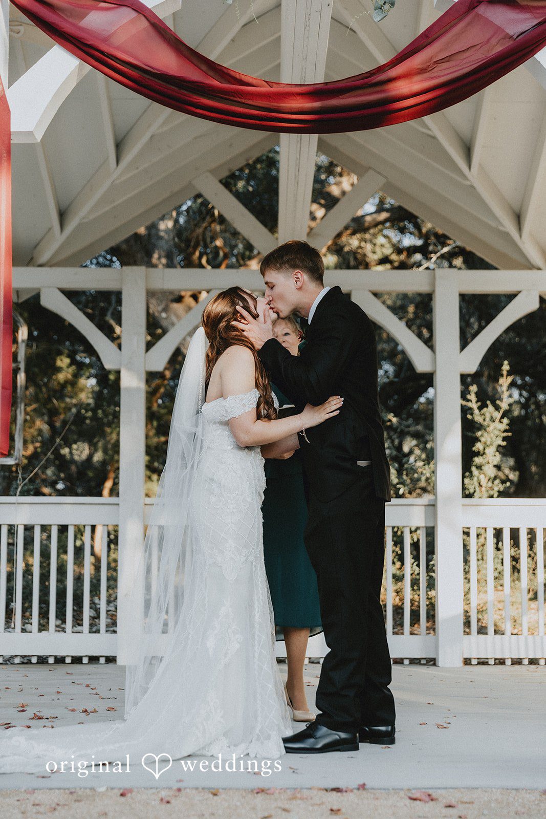 Romantic wedding kiss at Western Sky captured by San Antonio wedding photographers from Original Weddings