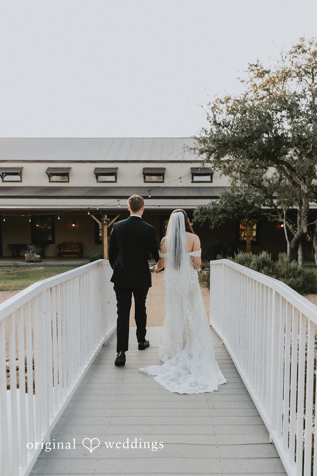 Newlywed walking together after ceremony at Western Sky