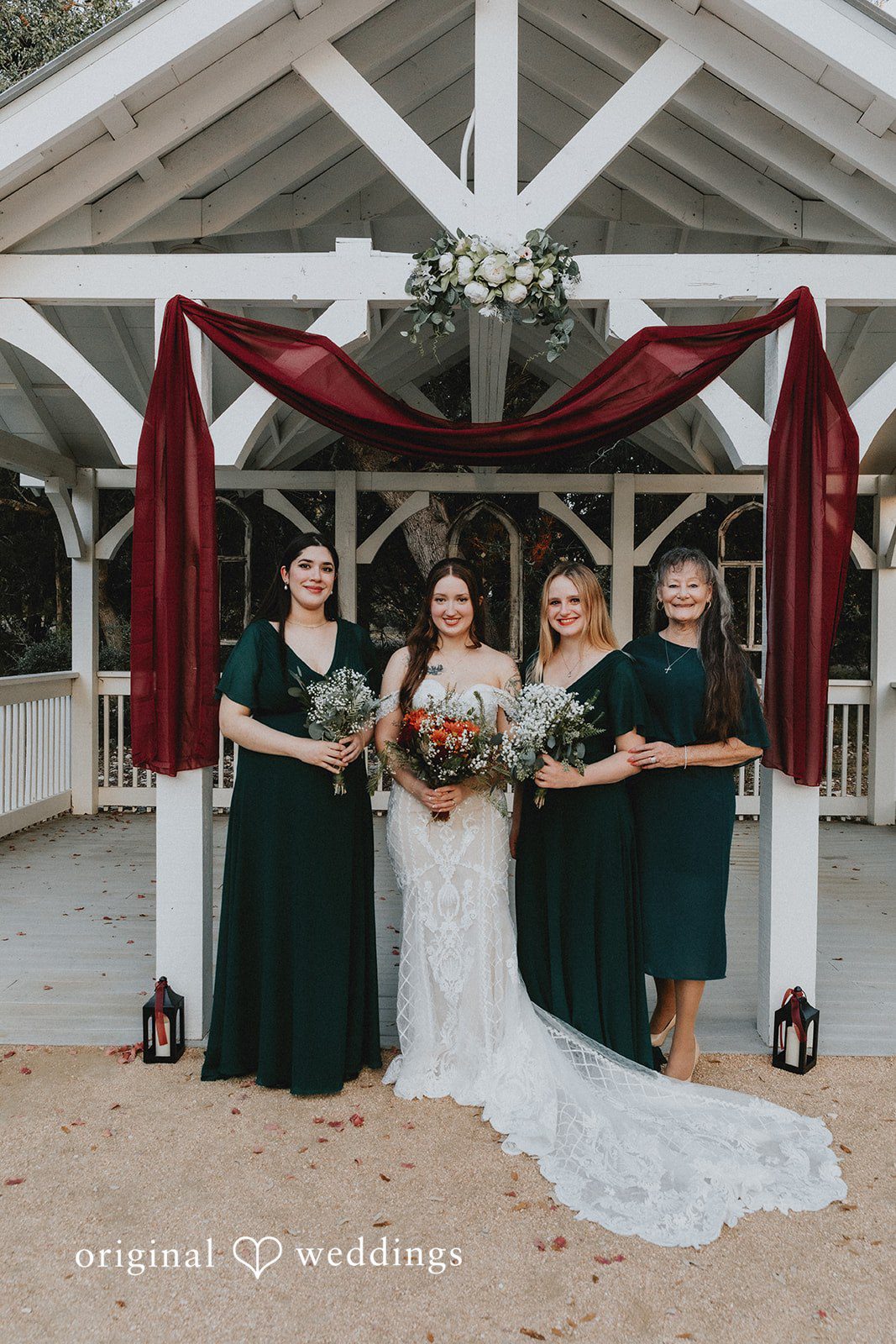 Bride posing with bridesmaid before ceremony at Western Sky wedding venue.