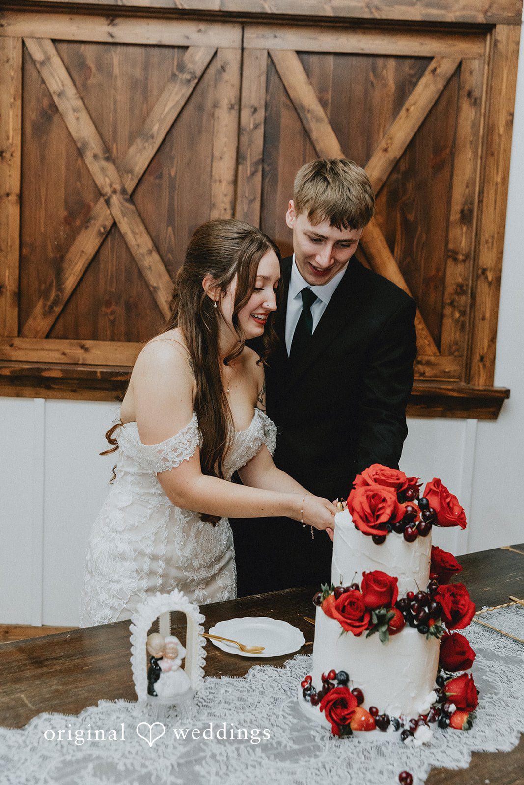 Romantic wedding cake cutting moment