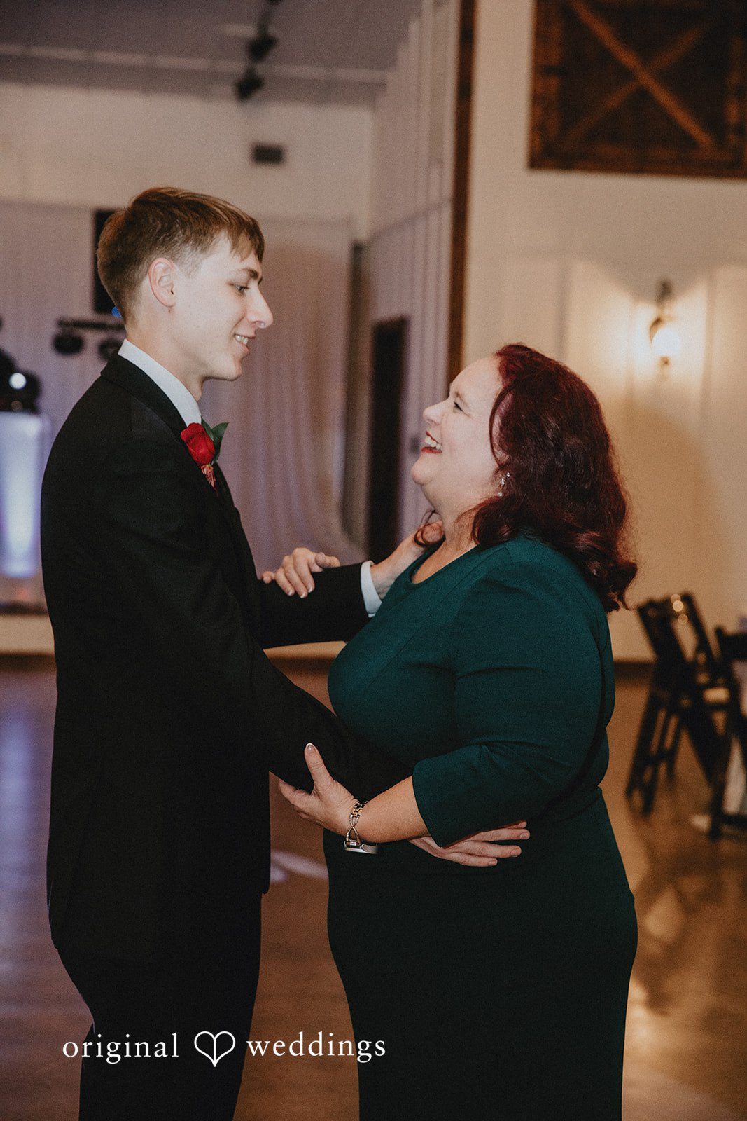 Groom dancing with family member