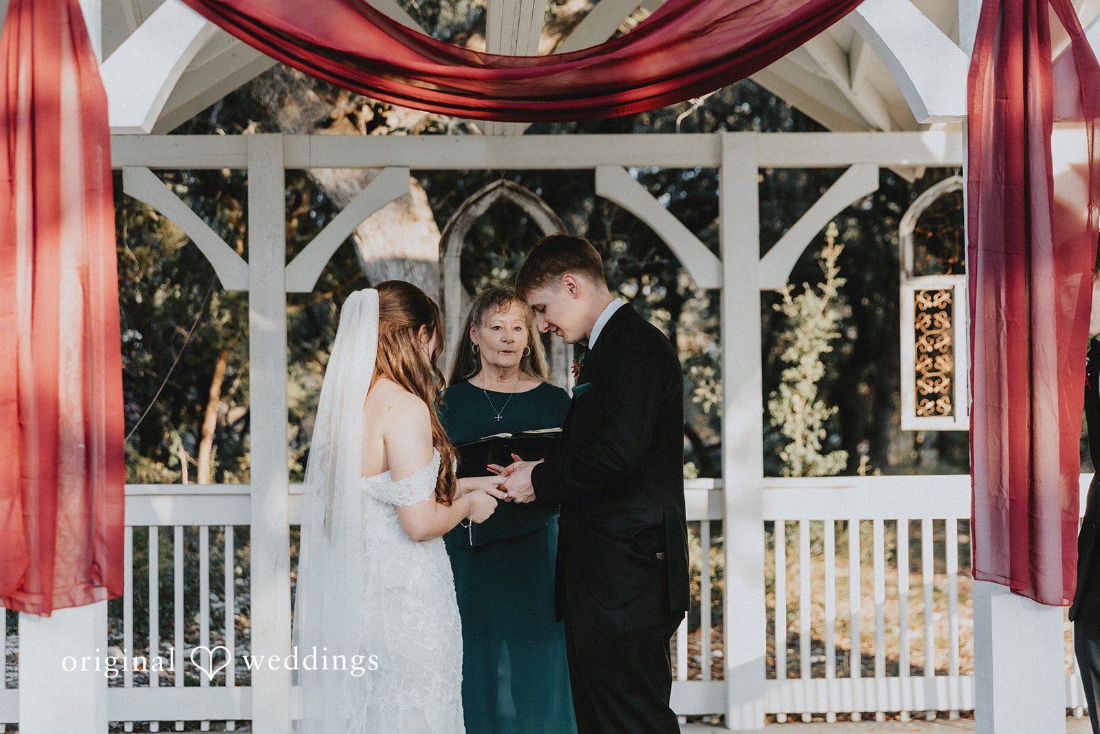 Bride and groom exchanging rings during ceremony at Western Sky in San Antonio