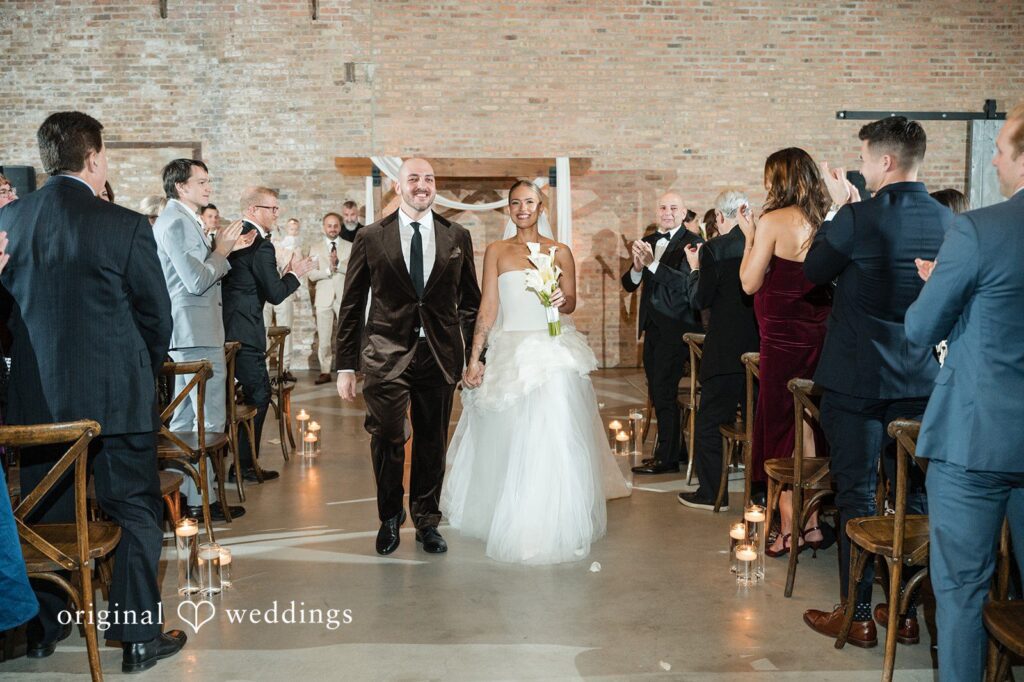 Erin + Zack Our Chicago wedding photographers captured the moment the couple made a joyful exit after their Wildman BT wedding ceremony