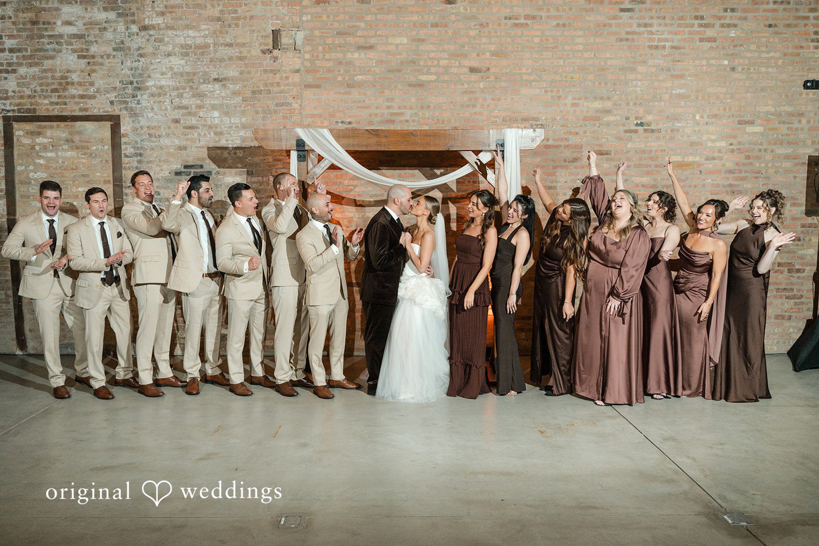 Erin + Zack A romantic portrait of the couple with cheers from their bridal party