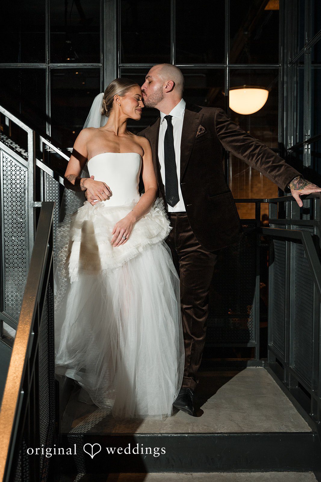 Erin + Zack A romantic portrait of the couple by the stairs