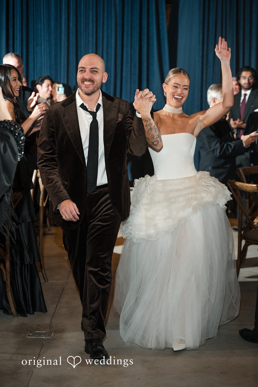 Erin + Zack The couple makes a joyful entrance to their wedding reception