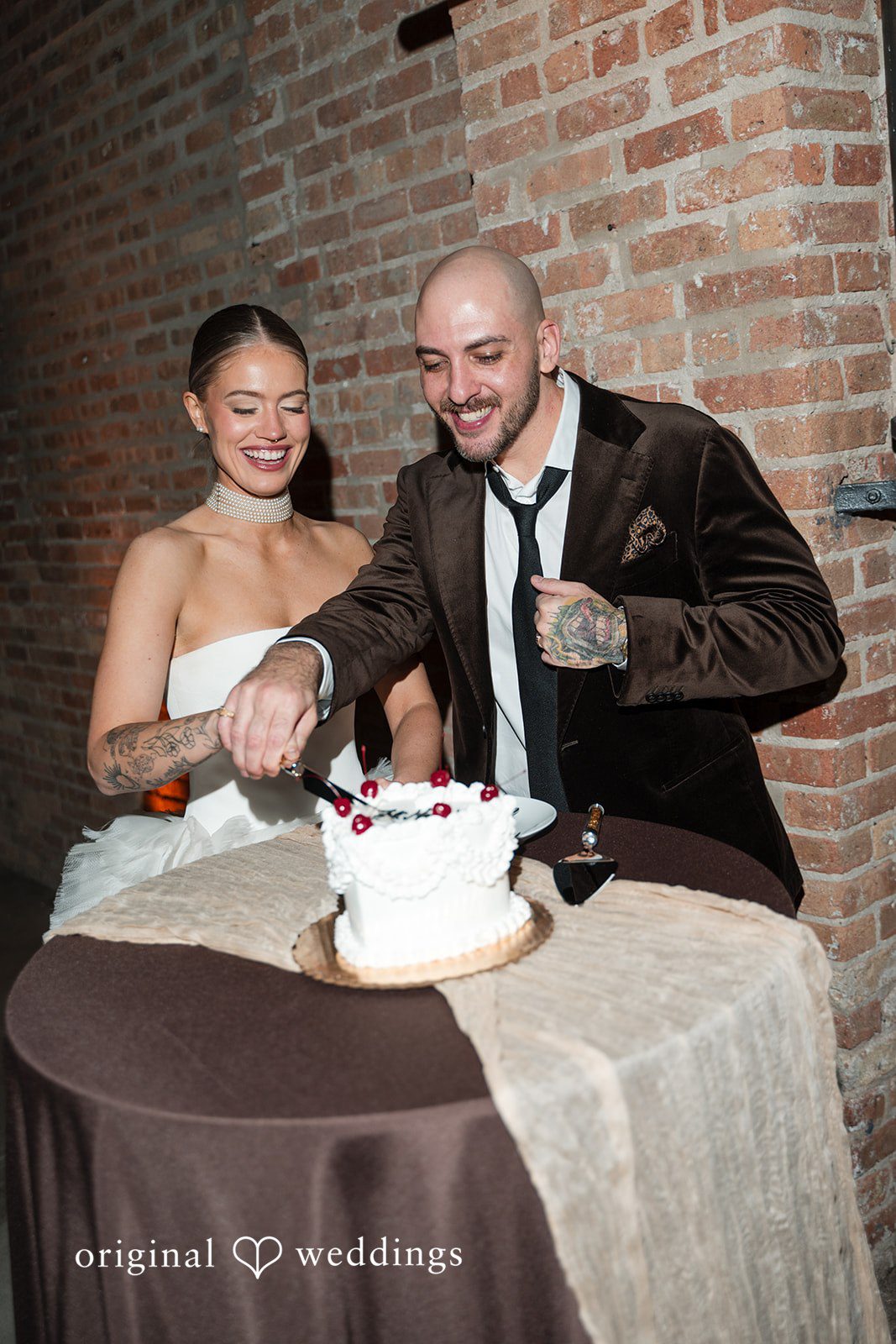 Erin + Zack The couple cuts their cake