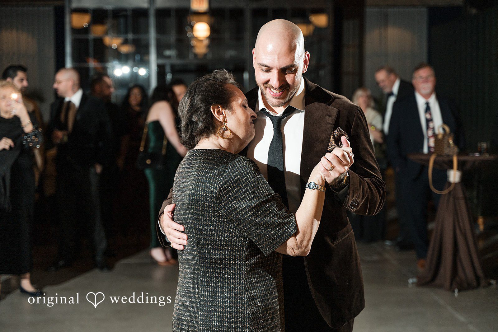 Erin + Zack Thr groom dances with his mother