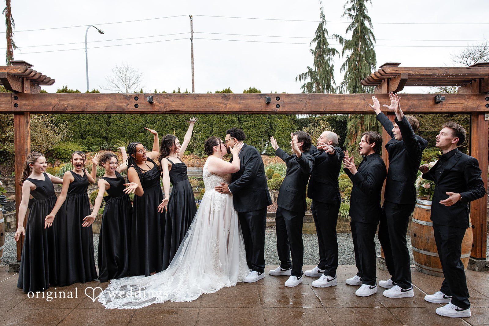 Seattle wedding photographers from Original Weddings capturing bride and groom kissing at Willows Lodge