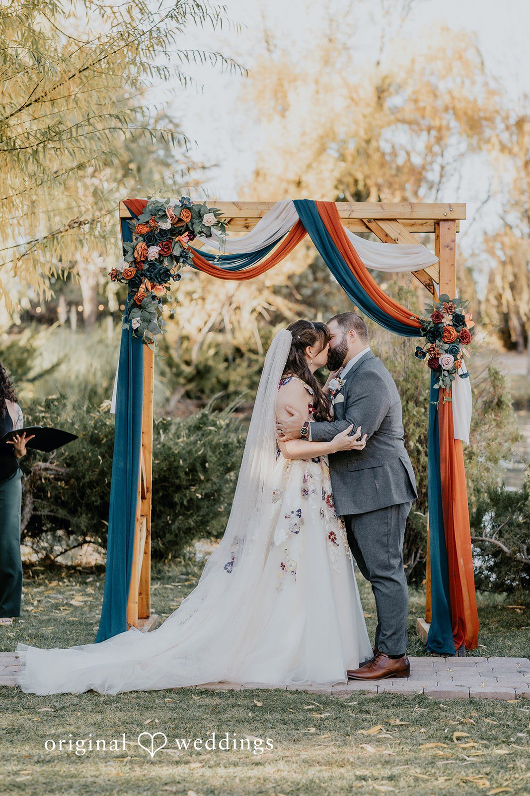 Elegant bride and groom kiss moment at Windmill House