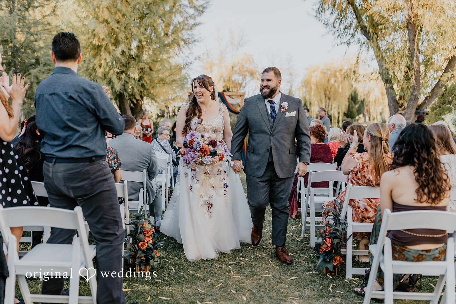 Romantic bride and groom exit moment at Windmill House