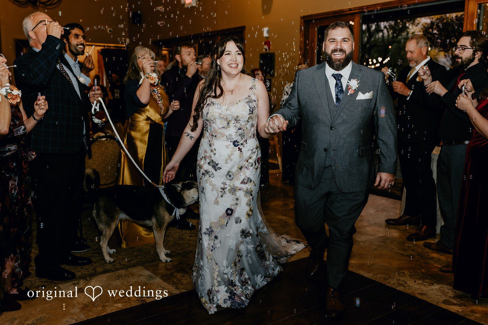 Phoenix Wedding Photographers capturing couple entering reception at Windmill House by Original Weddings
