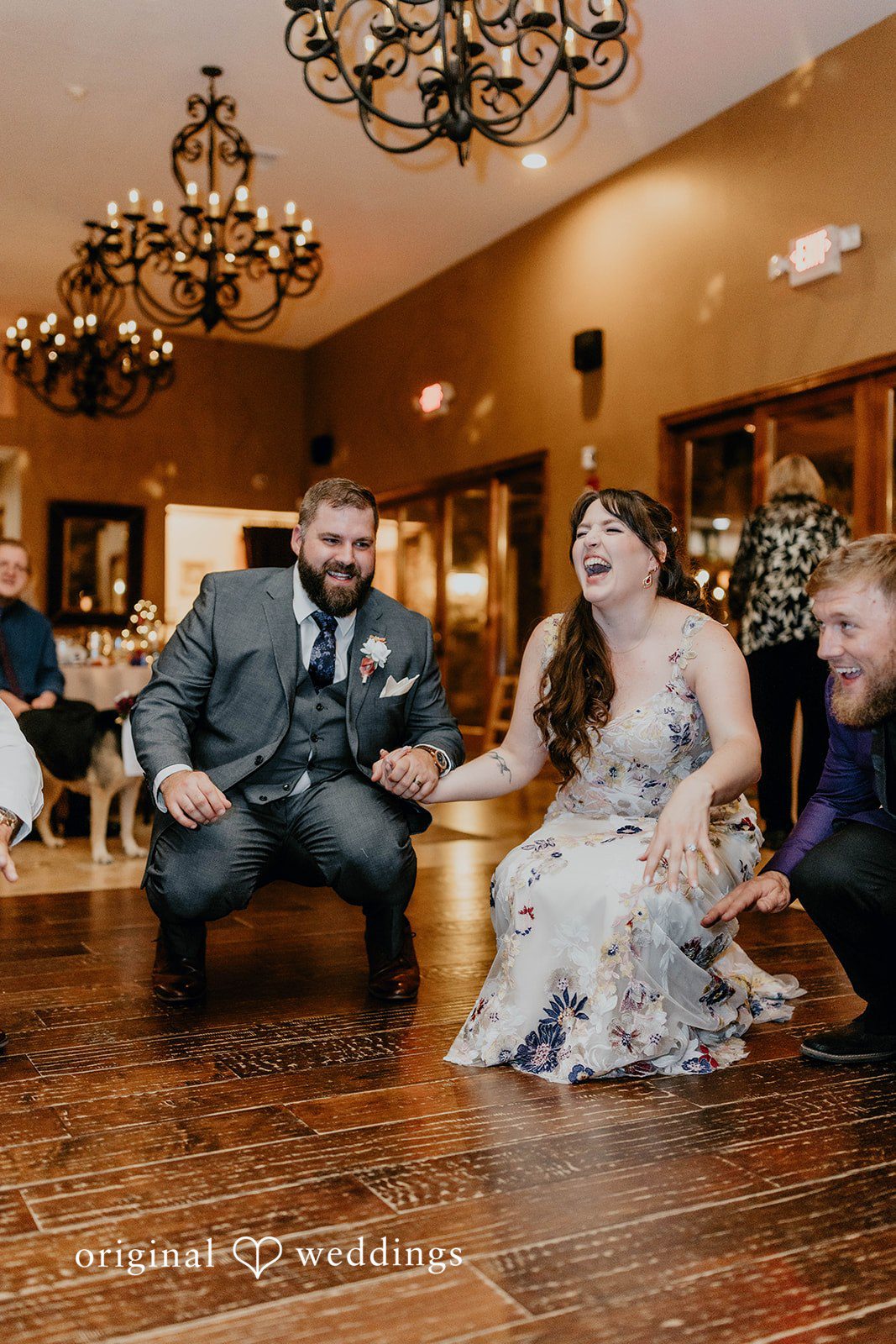 Phoenix Wedding Photographers capturing couple sitting while smiling at Windmill House by Original Weddings