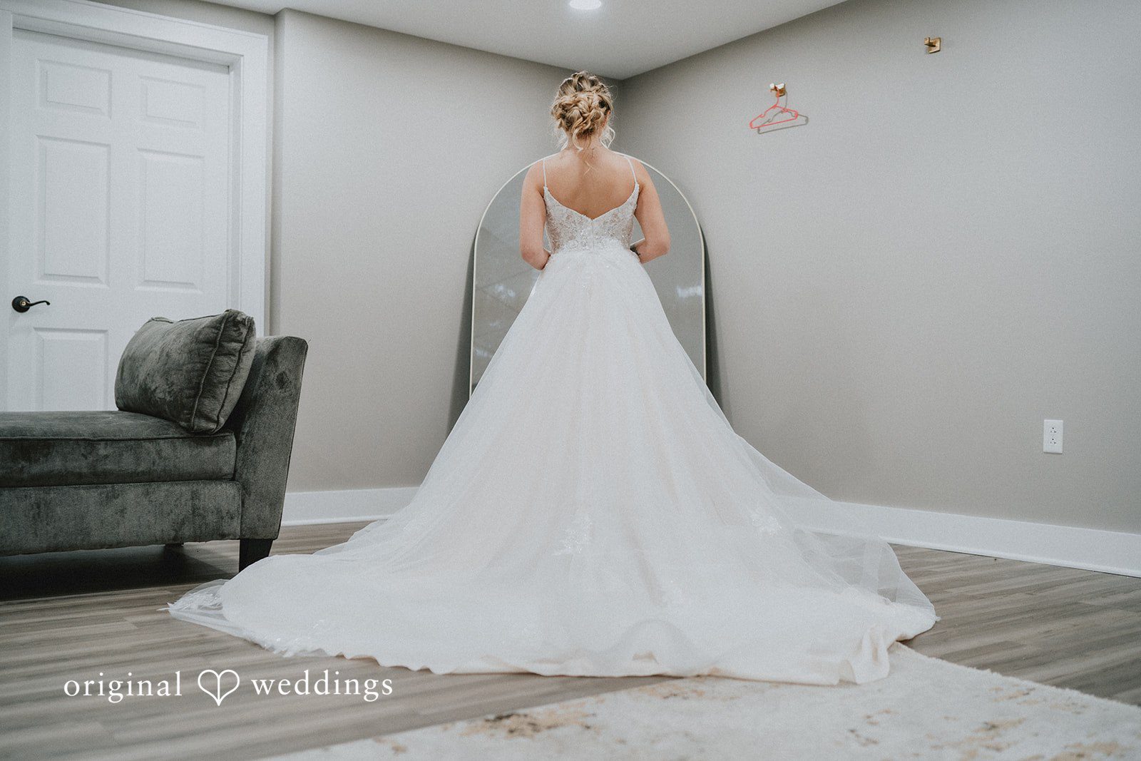 Sarah + Justin Bride standing elegantly in her wedding gown for a timeless portrait.