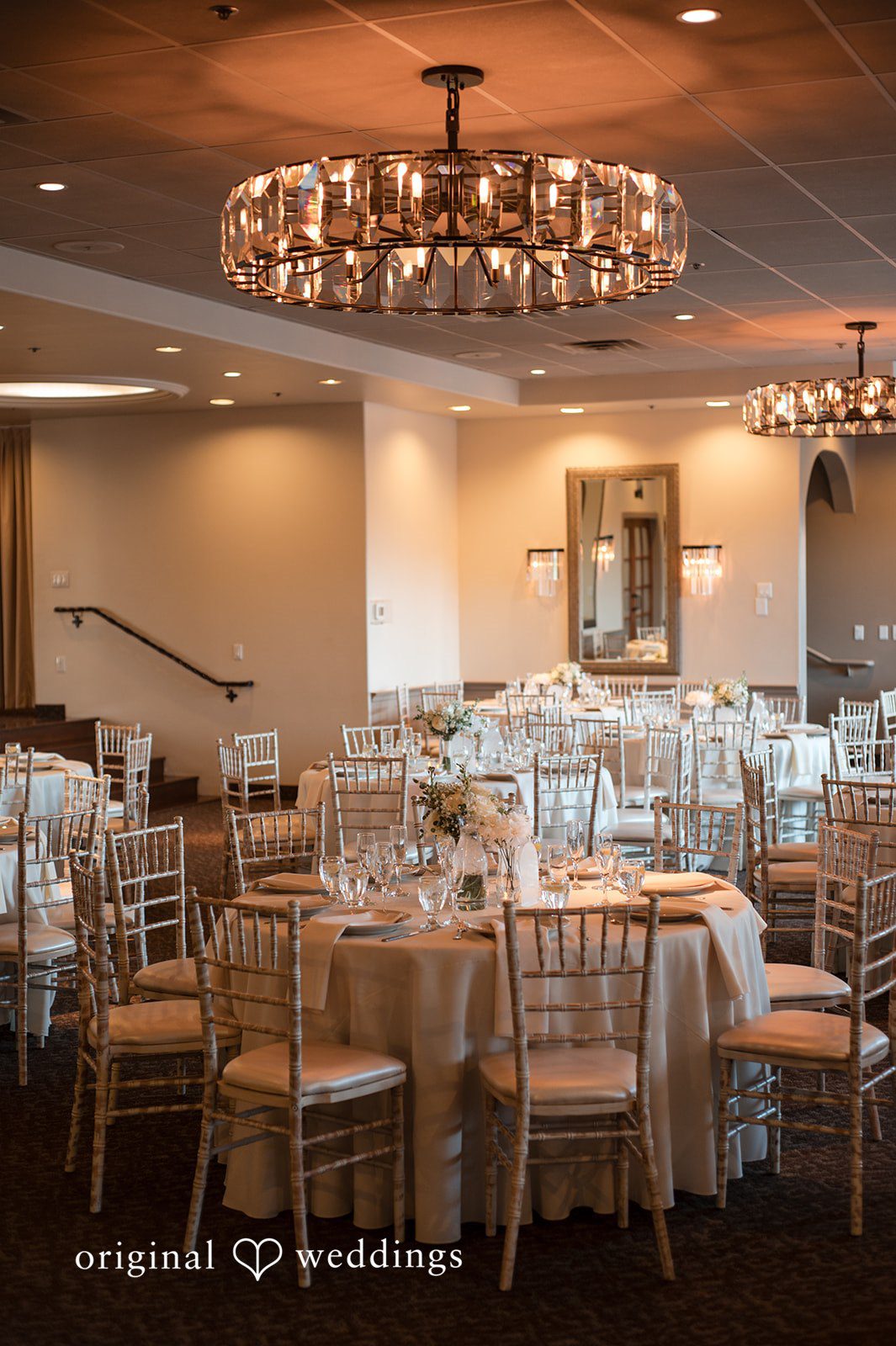 Romantic indoor dining setup for wedding reception