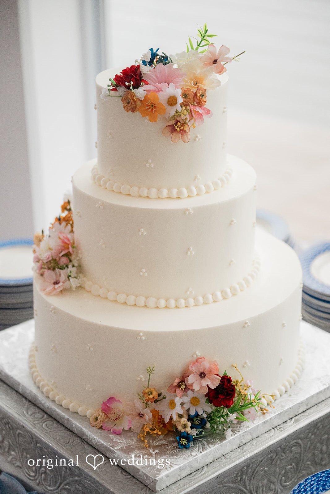 Elegant wedding cake decorated with flowers at Anchor Inn