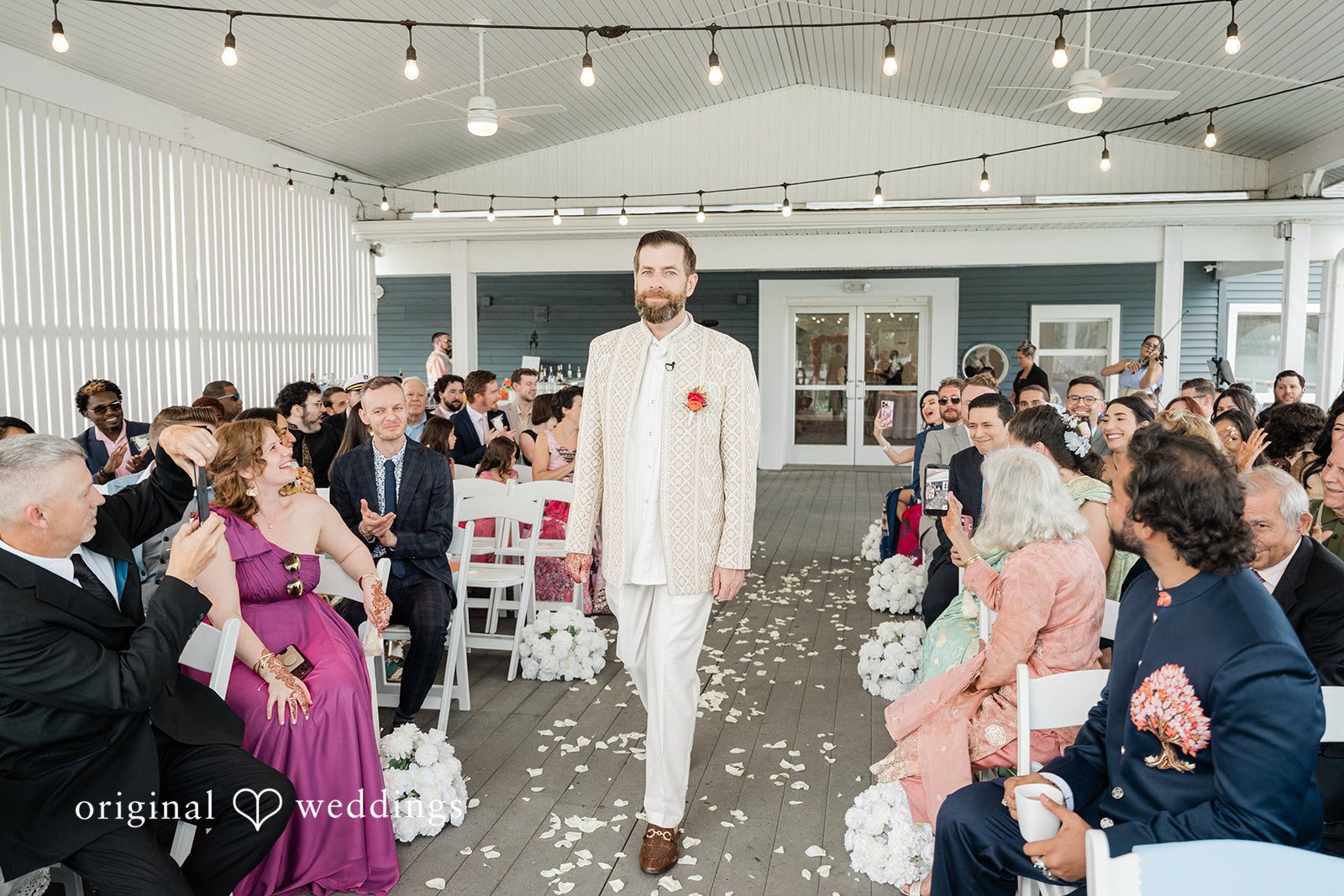 Groom walking down the aisle for wedding ceremony at Anchor Inn
