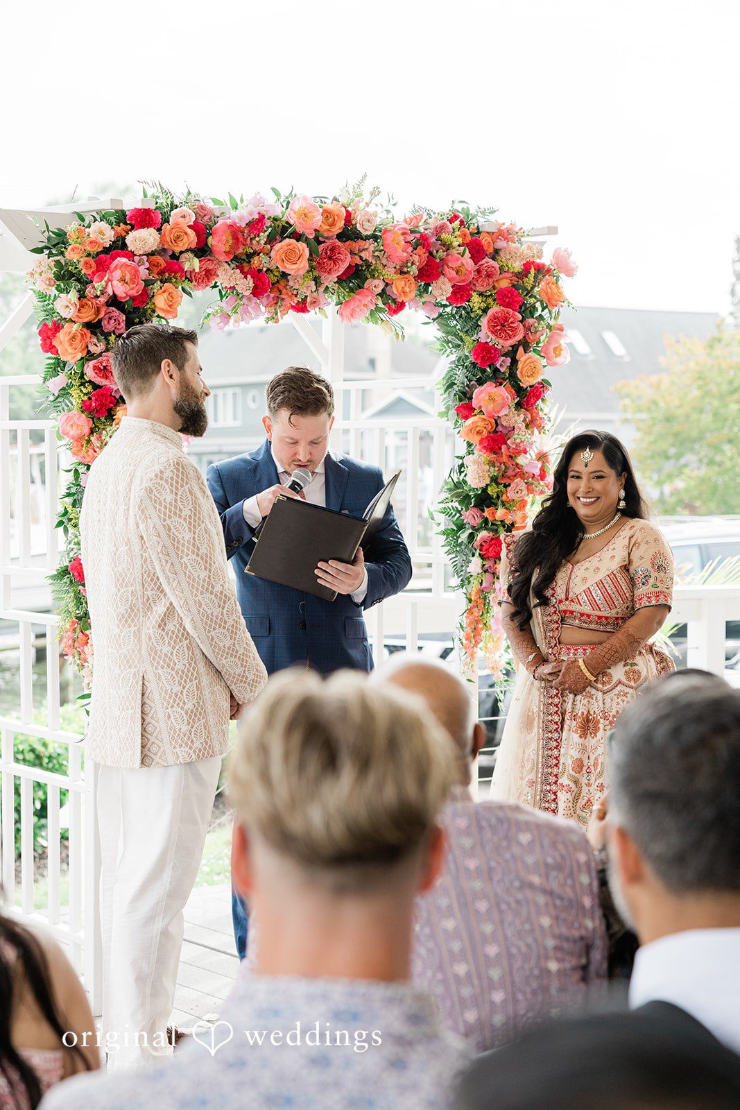 Beautiful picture of bride looking toward guests during wedding ceremony