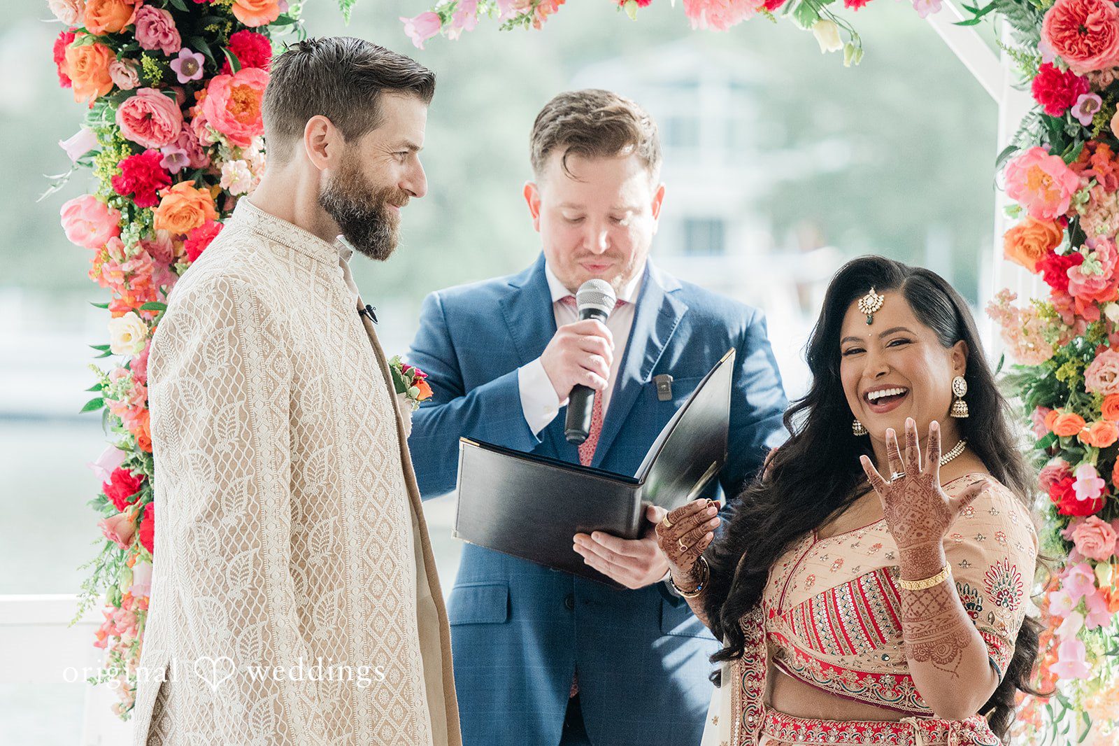Baltimore wedding photography by Original Weddings capturing lovely bride showing her wedding ring during wedding ceremony at Anchor Inn