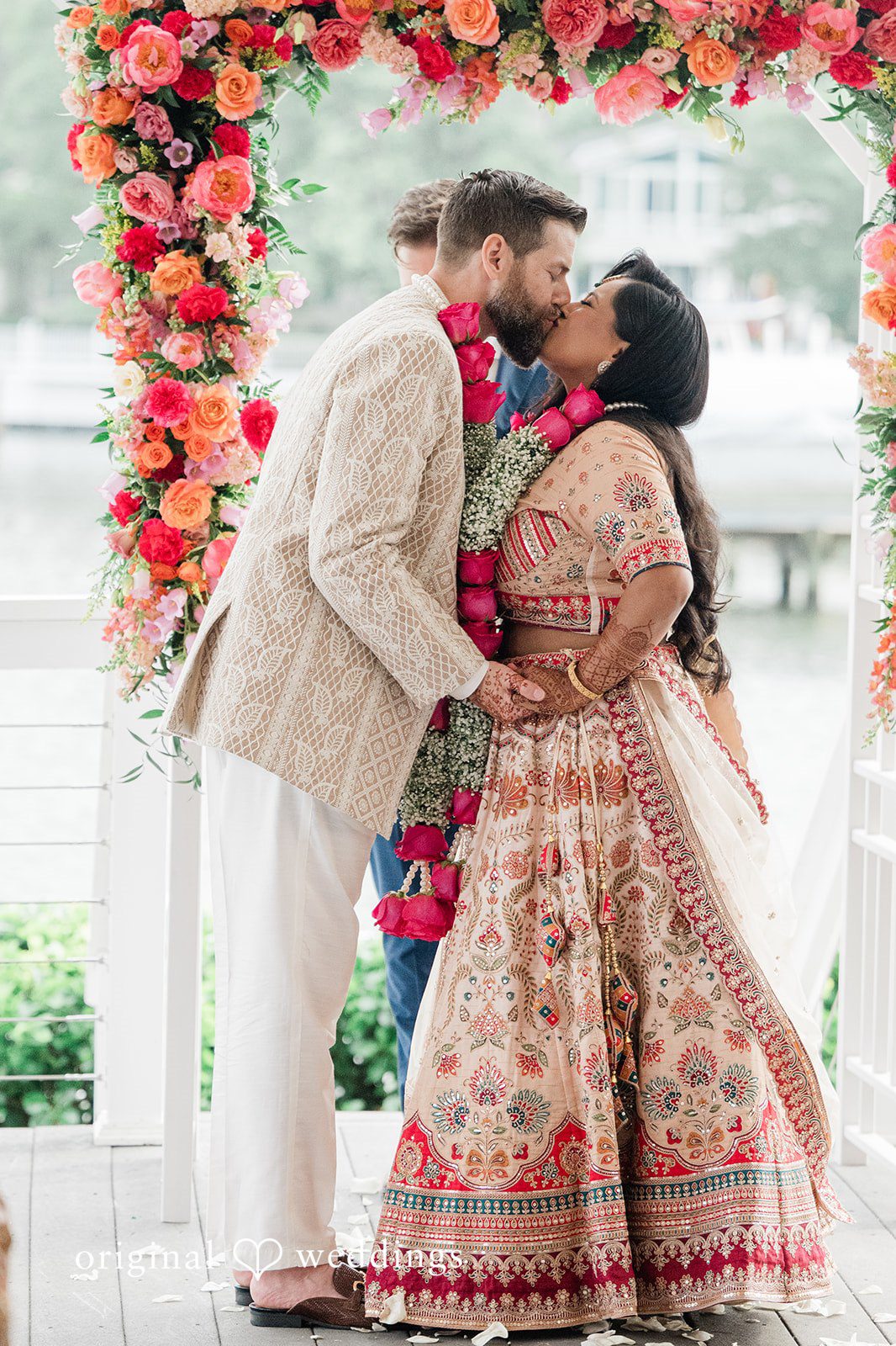 Romantic first kiss shared by bride and groom after wedding ceremony at Anchor Inn