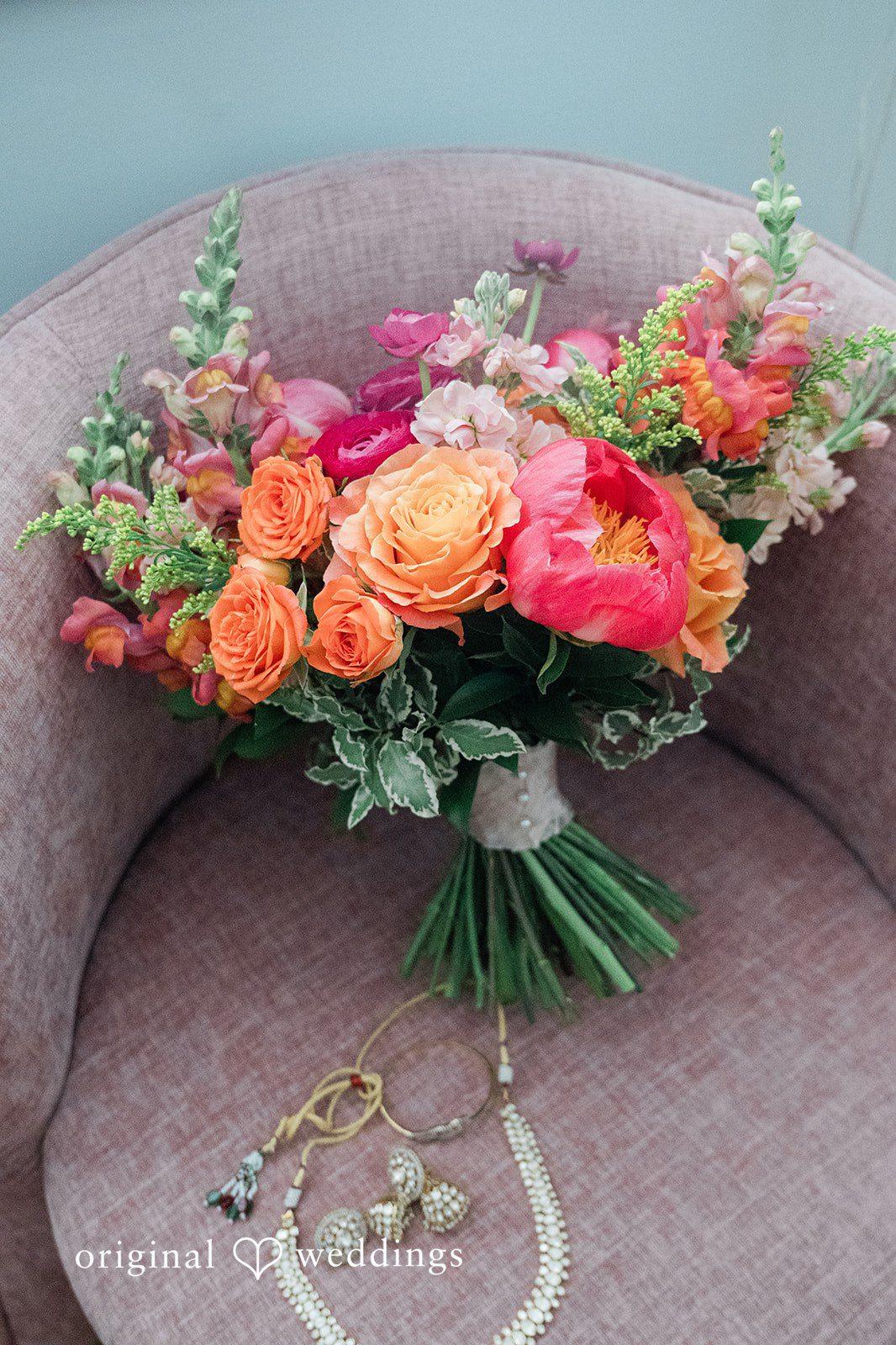 Bridal wedding accessories and a bouquet captured by team of Original Weddings