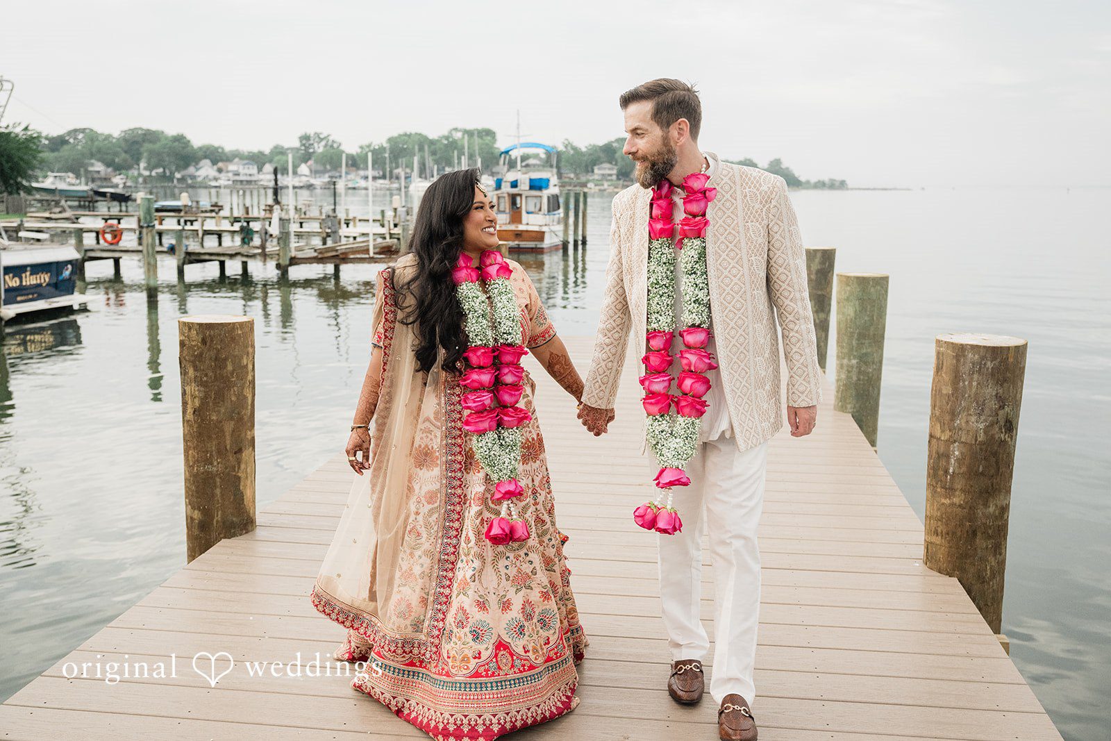 Couple walking hands in hands and looking at each other