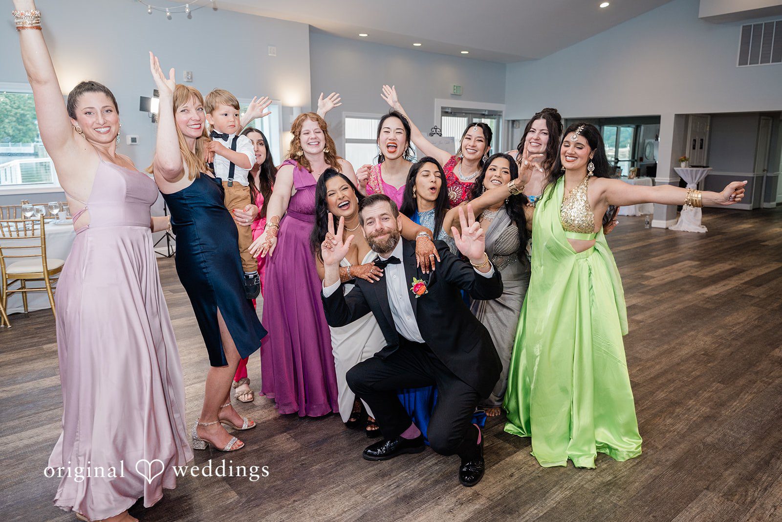 Couple having a joyful moments with the bridesmaids