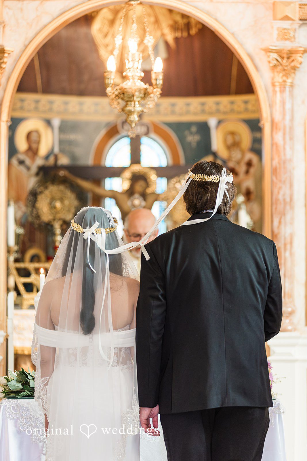 Zaina + Nick Beautiful back view wedding portrait of couple at Annunciation Greek Orthodox Church