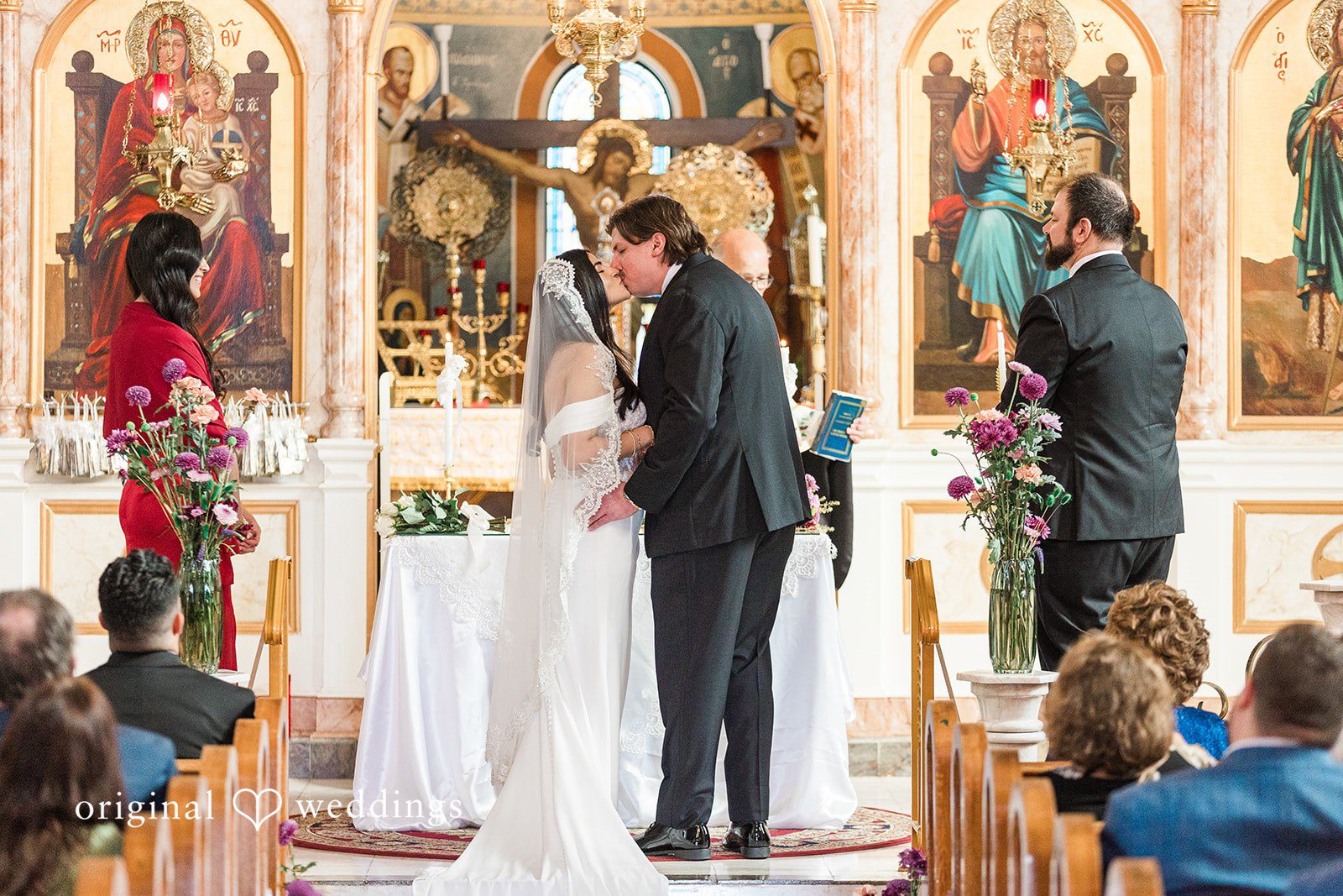 Zaina + Nick Romantic wedding kiss moment at Annunciation Greek Orthodox Church