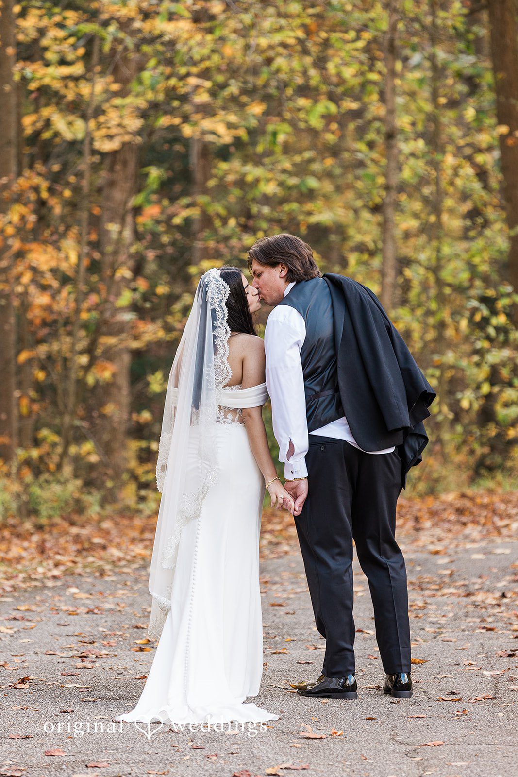 Zaina + Nick Cleveland Wedding Photographers capturing couple kissing at Annunciation Greek Orthodox Church by Original Weddings