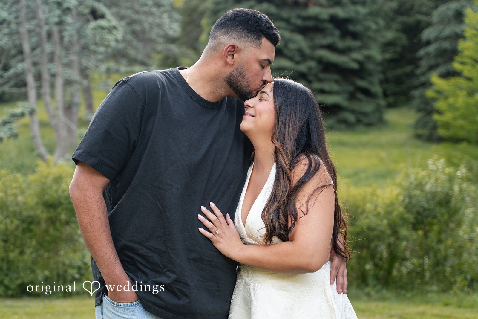 Anya + Max The couple shares a tender forehead kiss during their romantic engagement session at Arnold Arboretum.